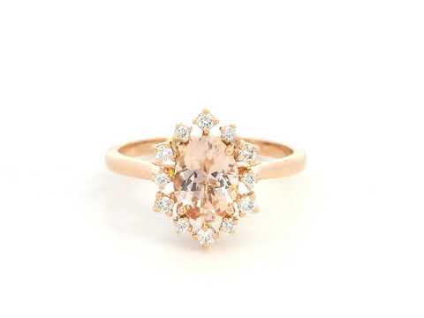 Oval-cut morganite and diamond ring in 18K rose gold, featuring a 1.03 carat morganite with a unique sunburst diamond halo, vintage Art Deco design by Emirates Diamonds