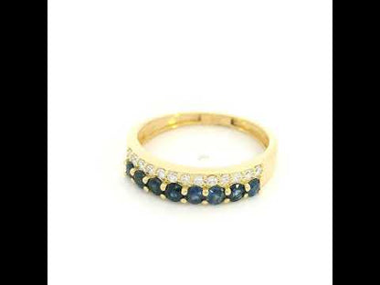 18K yellow gold band ring with two adjacent rows of round blue sapphires and white diamonds across the front.
