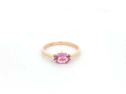 Oval pink sapphire ring with diamond accents in 18K rose gold by Emirates Diamonds
