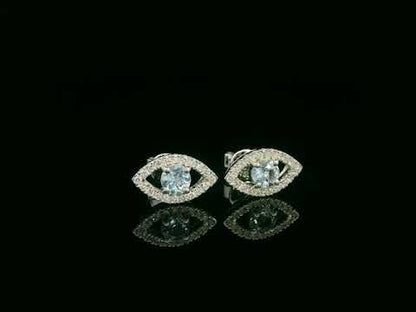 18K white gold evil-eye stud earrings with 0.40ct aquamarine center and 0.23ct pavé diamond halo