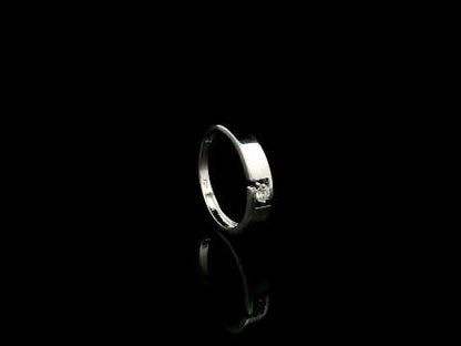 18K white gold floating diamond ring featuring a 0.08 carat natural round brilliant solitaire in a modern open band.