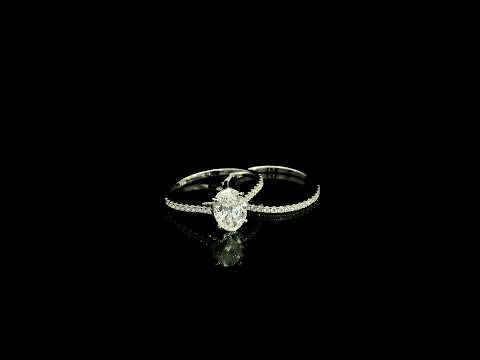 Oval cut diamond bridal set in 18K white gold featuring a GIA certified 1.50 carat natural oval diamond with matching diamond wedding band.