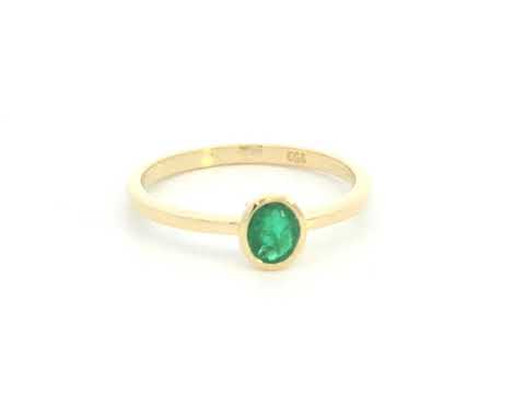 18K yellow gold emerald solitaire ring with bezel setting by Emirates Diamonds