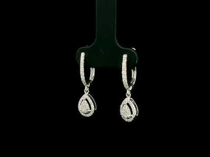 18K white gold pear diamond drop earrings featuring 0.44 carat natural diamonds with diamond-set huggie hoops and open pear halo design.