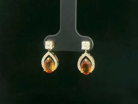 Oval citrine and diamond halo earrings in 18K yellow gold by Emirates Diamonds
