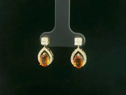 Oval citrine and diamond halo earrings in 18K yellow gold by Emirates Diamonds