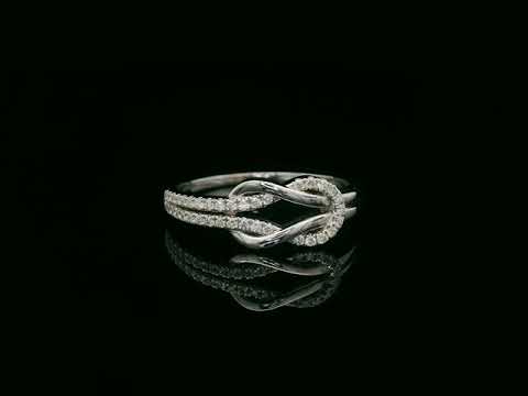 18K white gold diamond knot ring with pavé-set diamonds – minimalist symbolic jewelry by Emirates Diamonds
