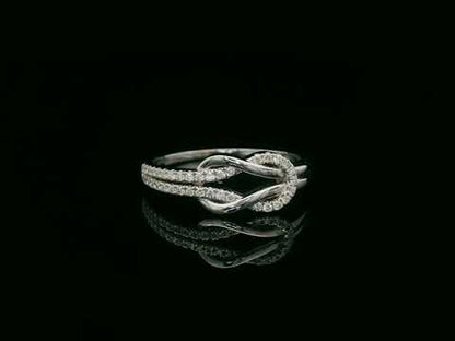 18K white gold diamond knot ring with pavé-set diamonds – minimalist symbolic jewelry by Emirates Diamonds