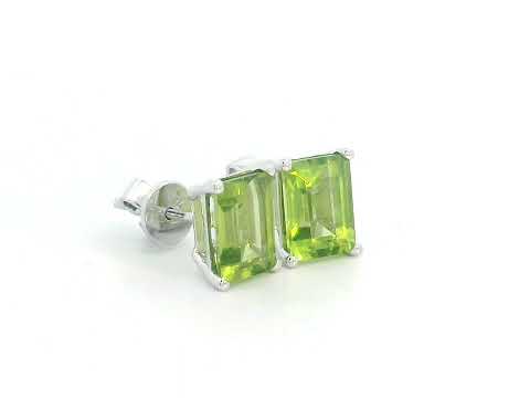 Emerald cut Peridot earrings in 18K white gold, featuring 3.30 carats of vibrant green gemstones in a four-prong setting, symbolizing strength and renewal for those born in August