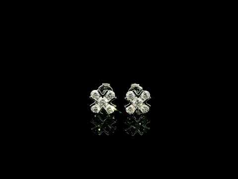 Four-petal diamond flower stud earrings in 18K white gold featuring round brilliant diamonds with minimal visible metal.