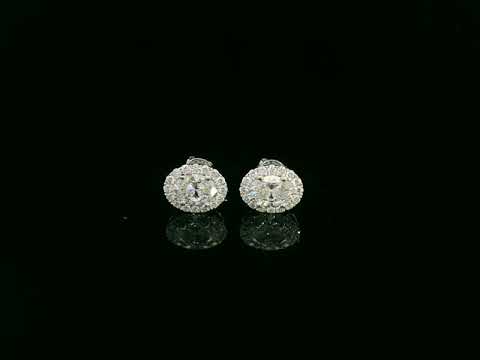 18K white gold oval cut diamond halo stud earrings with 1.40 carat GIA certified diamonds by Emirates Diamonds