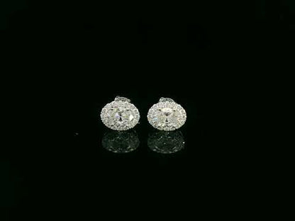 18K white gold oval cut diamond halo stud earrings with 1.40 carat GIA certified diamonds by Emirates Diamonds