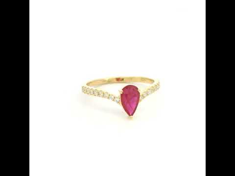 Pear shaped ruby and diamond ring in 18K yellow gold with diamond set shoulders