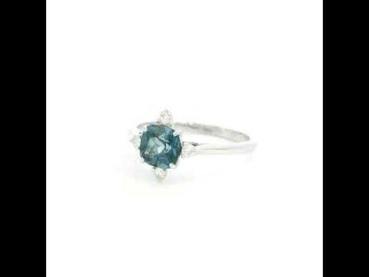 18K white gold London Blue Topaz ring featuring a 1.10 carat natural cushion-cut London Blue Topaz with 0.14 carat natural diamond accents.