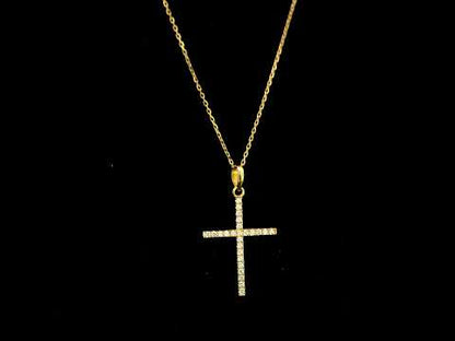 18K yellow gold diamond cross pendant featuring 0.26 carat natural round brilliant diamonds. Chain sold separately.