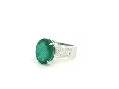 Oval emerald statement ring in 18K white gold with diamond-set shoulders by Emirates Diamonds.