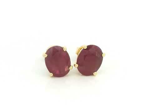 18K yellow gold ruby stud earrings featuring oval-cut natural rubies totaling 5.19 carats by Emirates Diamonds.