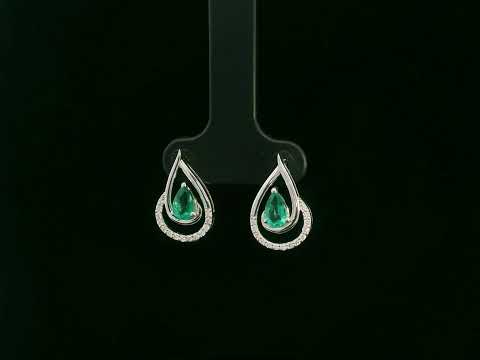 Emerald and diamond stud earrings in 18K white gold with pear-cut emeralds and pavé diamond accents by Emirates Diamonds