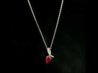 Pear shaped ruby and diamond pendant in 18K white gold