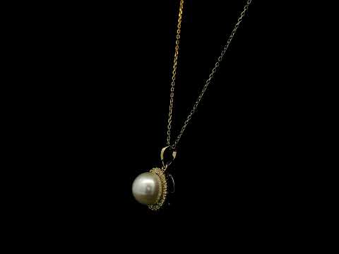 Freshwater white pearl and diamond halo pendant in 18K yellow gold with a round pearl surrounded by brilliant diamonds.