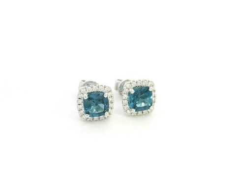 18K white gold blue topaz and diamond halo stud earrings by Emirates Diamonds