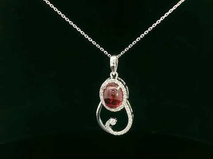 18k white gold swirl pendant with 1.99ct cabochon ruby & 0.21ct diamonds – certificate included