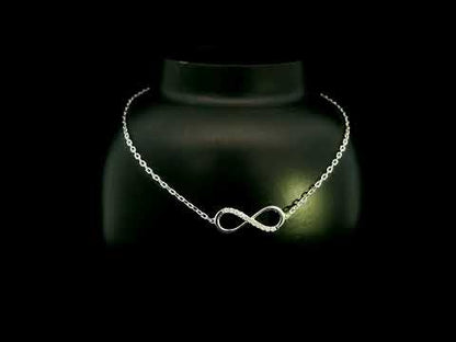 Diamond infinity bracelet in 18K White Gold featuring a pavé-set infinity motif with 0.05 carat natural diamonds.
