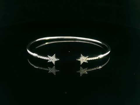 18K gold open bangle with pavé diamond star motifs on each end – 0.22 carats total.

