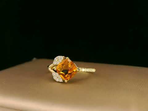 18K yellow gold ring featuring a 1.33ct cushion citrine with diamond leaf design, nature-inspired luxury style.