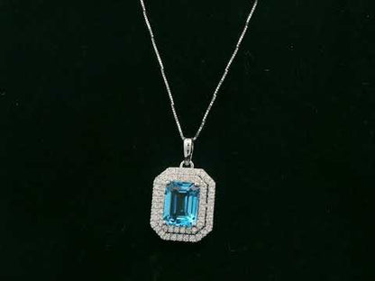 Swiss Blue Topaz & Diamond Halo Pendant in 18K White Gold