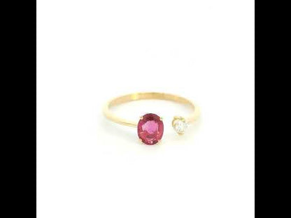 18K yellow gold open ruby and diamond ring with a 0.50 carat oval ruby and natural round diamond