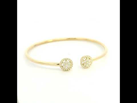 18K yellow gold open cuff bangle with two round natural diamond cluster ends.