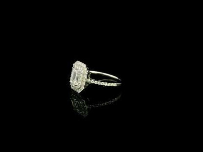 18K white gold halo engagement ring featuring a 1.00 carat GIA certified natural emerald cut diamond with VVS2 clarity and E colour, surrounded by a double halo and 0.43 carat natural round brilliant diamonds.
