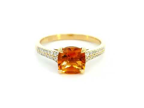 Luxury 18K gold cushion-cut citrine ring with a 1.30-carat natural citrine and 0.21-carat diamond-accented band in a four-prong setting.