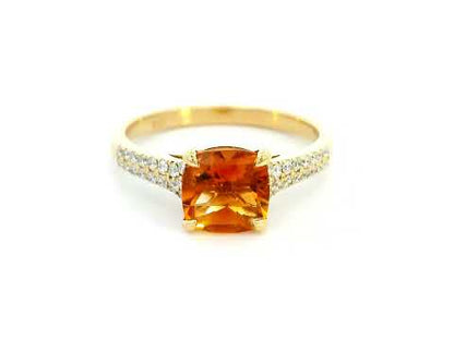 Luxury 18K gold cushion-cut citrine ring with a 1.30-carat natural citrine and 0.21-carat diamond-accented band in a four-prong setting.