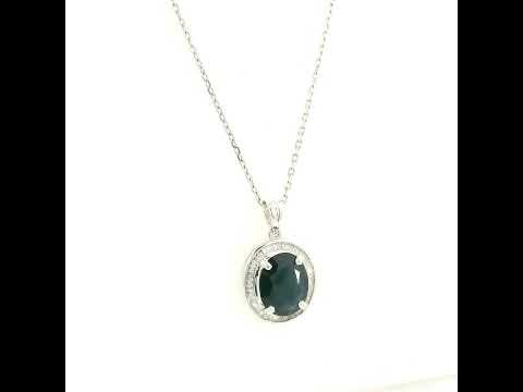 18K white gold oval blue sapphire pendant featuring a 2.71 carat natural blue sapphire surrounded by a baguette diamond halo with 0.32 carat natural diamonds. Pendant only, chain not included.