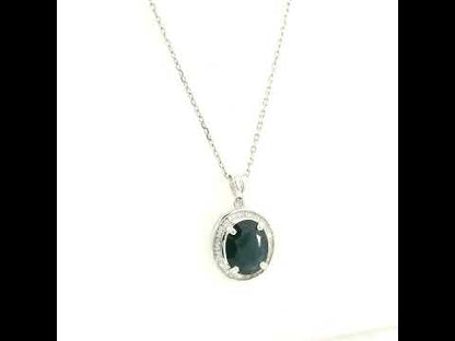18K white gold oval blue sapphire pendant featuring a 2.71 carat natural blue sapphire surrounded by a baguette diamond halo with 0.32 carat natural diamonds. Pendant only, chain not included.