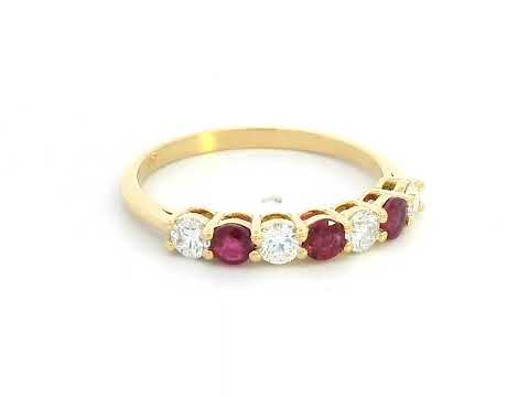 18K yellow gold ring with alternating rubies and diamonds, elegant half-eternity band design.