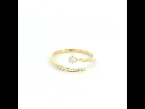 18K yellow gold open diamond ring featuring a round brilliant diamond with a curved row of natural diamonds in a minimalist wrap design.