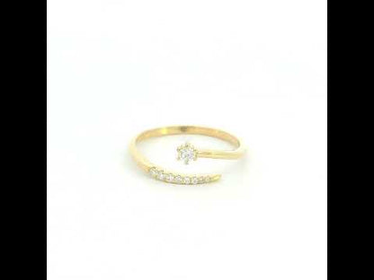 18K yellow gold open diamond ring featuring a round brilliant diamond with a curved row of natural diamonds in a minimalist wrap design.