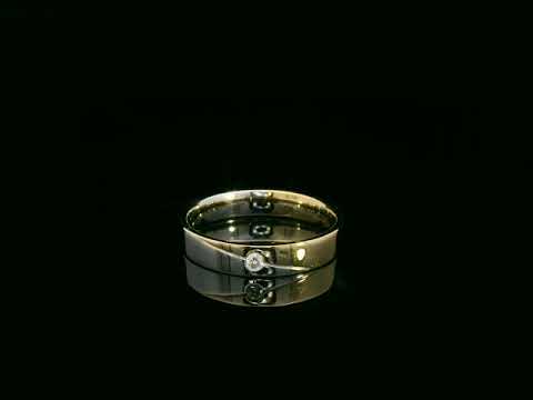 Unisex 18K two-tone wedding band with 0.03 carat bezel-set diamond, sleek modern flat profile