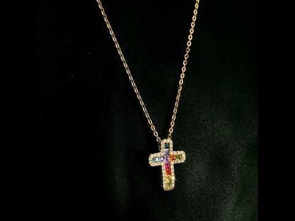 Multicolour sapphire and diamond cross necklace in 18K rose gold with colourful sapphires surrounded by round brilliant diamonds.