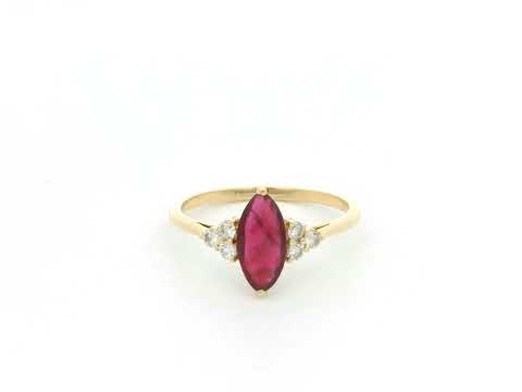 Natural 1.03 carat marquise ruby and diamond ring in solid 18K yellow gold with 0.21 carat natural diamond accents by Emirates Diamonds.