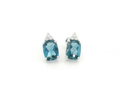 18K white gold London Blue Topaz stud earrings featuring 2.94 carats of cushion cut London Blue Topaz with diamond accents