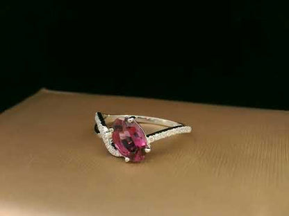 18K white gold Rhodolite garnet and diamond crossover ring with oval-cut center stone