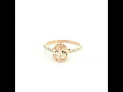 Oval morganite diamond ring handcrafted in 18K rose gold featuring a 1.84 carat natural oval morganite with 0.16 carat natural diamond pavé band.