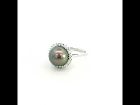 South Sea black pearl and diamond halo ring in 18K white gold featuring a lustrous dark pearl surrounded by round brilliant diamonds.