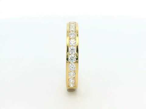 Elegant 18K yellow gold eternity band featuring 0.63ct channel-set round diamonds, perfect as a wedding, stacking, or anniversary ring.