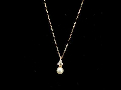 18K rose gold freshwater pearl pendant necklace featuring a white freshwater pearl suspended beneath a natural diamond cluster.