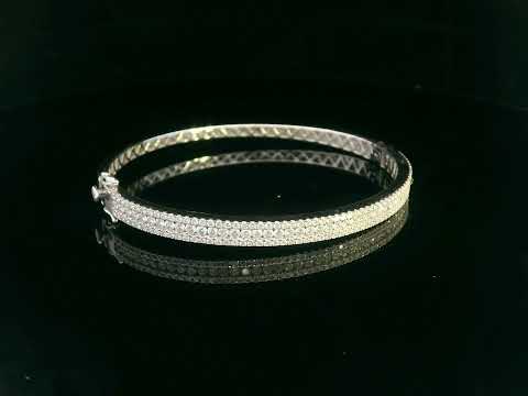 18K white gold bangle with triple row diamond setting featuring 2.36 carats of round diamonds and a secure clasp